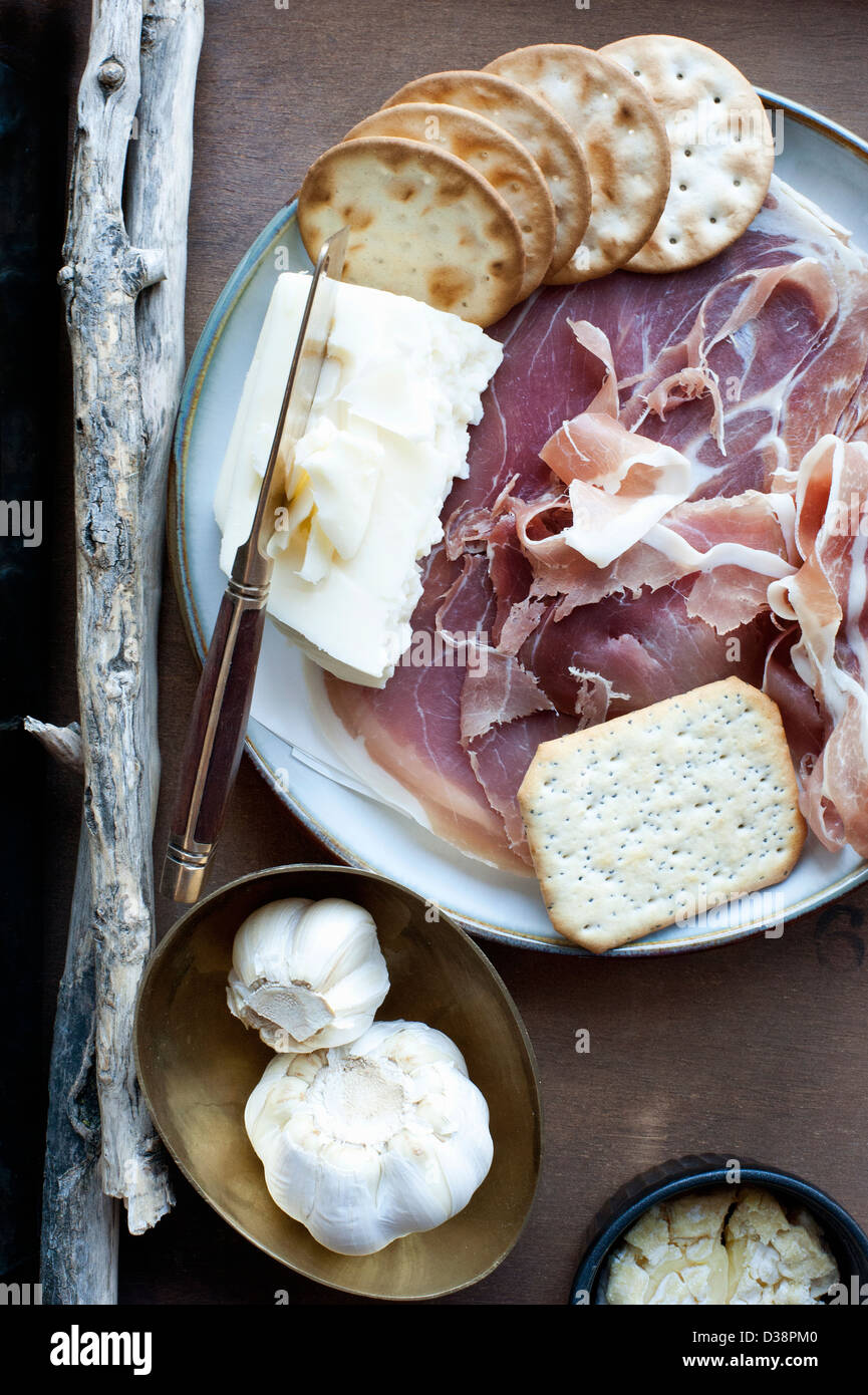 Garlic, crackers, cheese and meat Stock Photo Alamy