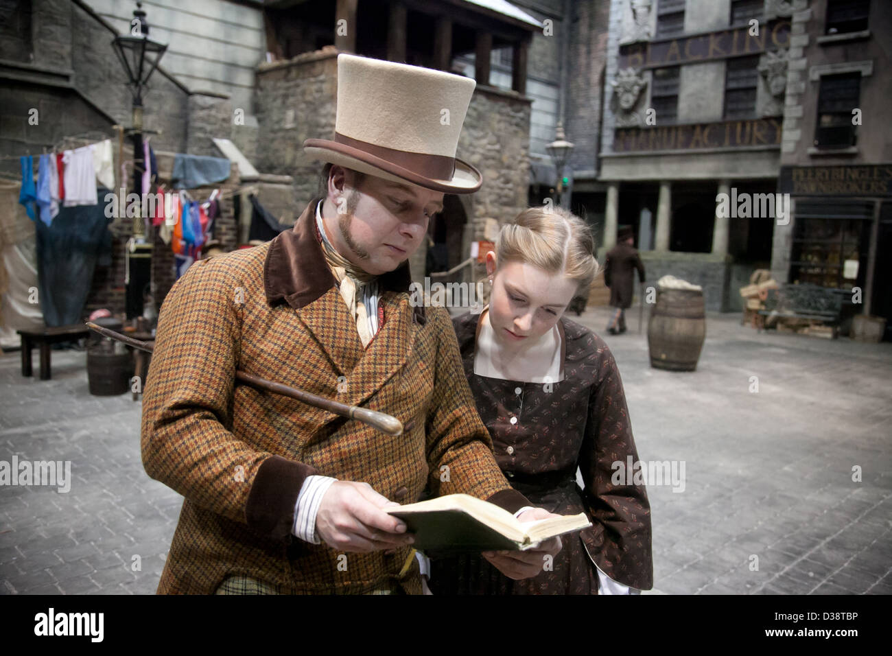 Actors portraying Victorian Dickensian characters at Dickens World in UK Stock Photo