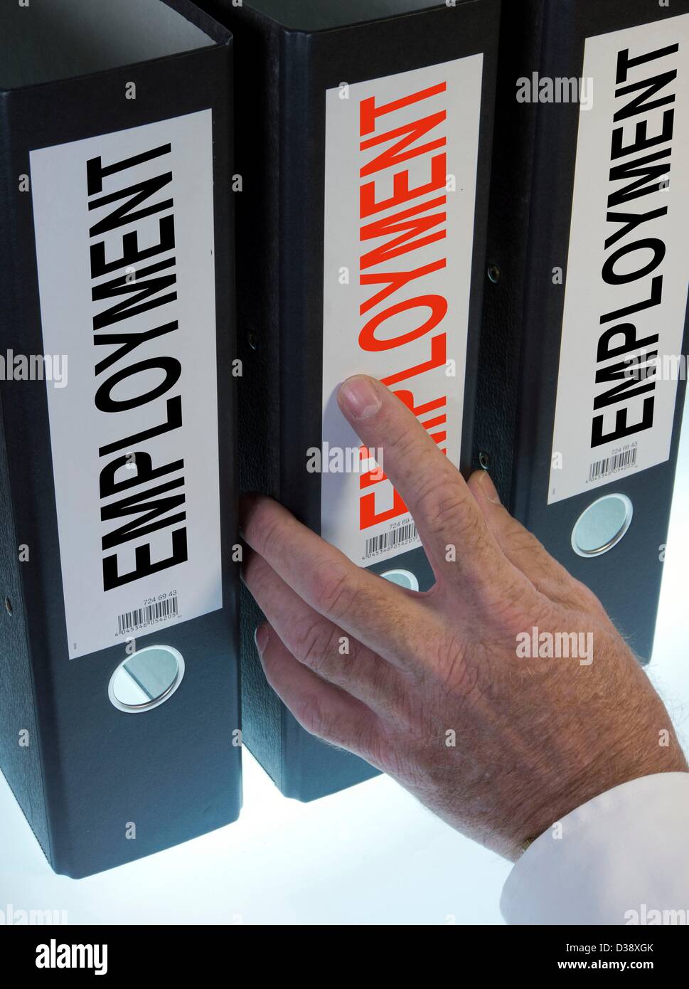 Symbol image,hand pointing to a file folder  labeled Employment Stock Photo