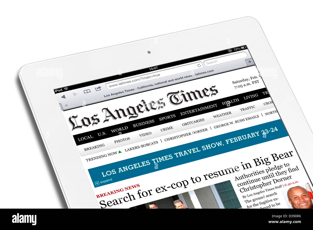 Reading the online edition of the Los Angeles Times on a 4th generation Apple iPad, USA Stock Photo