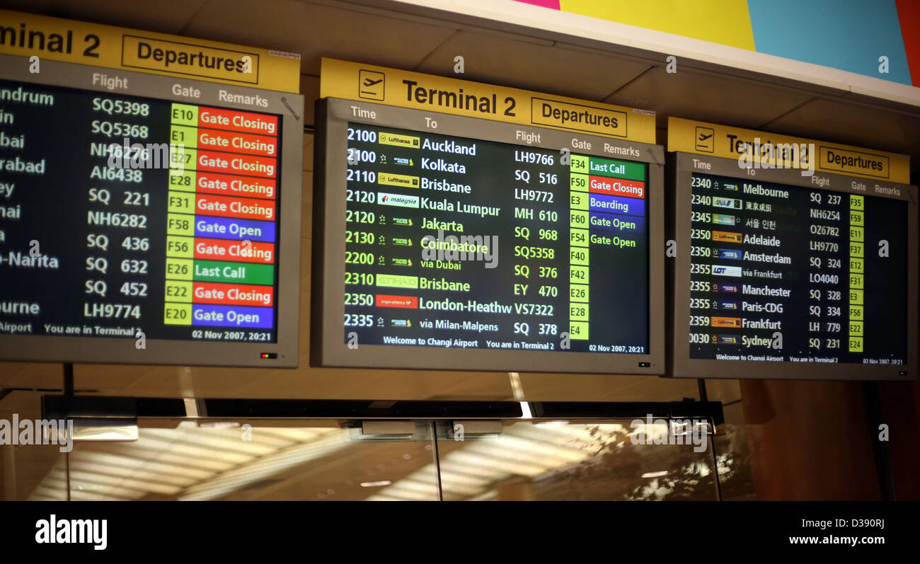 a flight announcement shows time of departure on a screen Stock Photo
