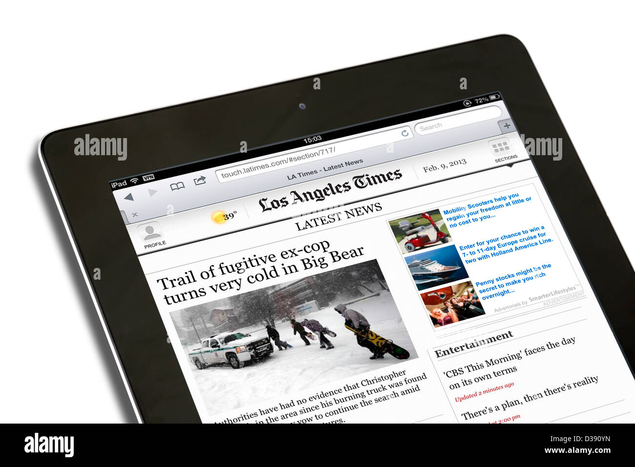 Reading the online edition of the Los Angeles Times on a 4th generation Apple iPad, USA Stock Photo