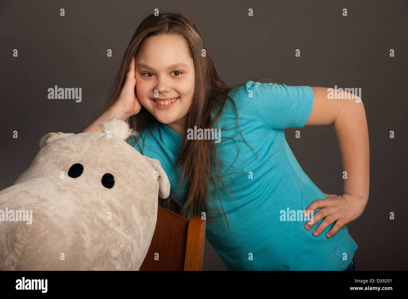 Portrait of a smiling girl in a studio Stock Photo - Alamy
