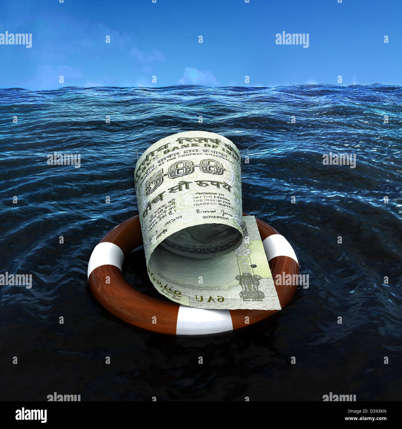 Indian five hundred rupee note on life preserver tube in the sea Stock Photo