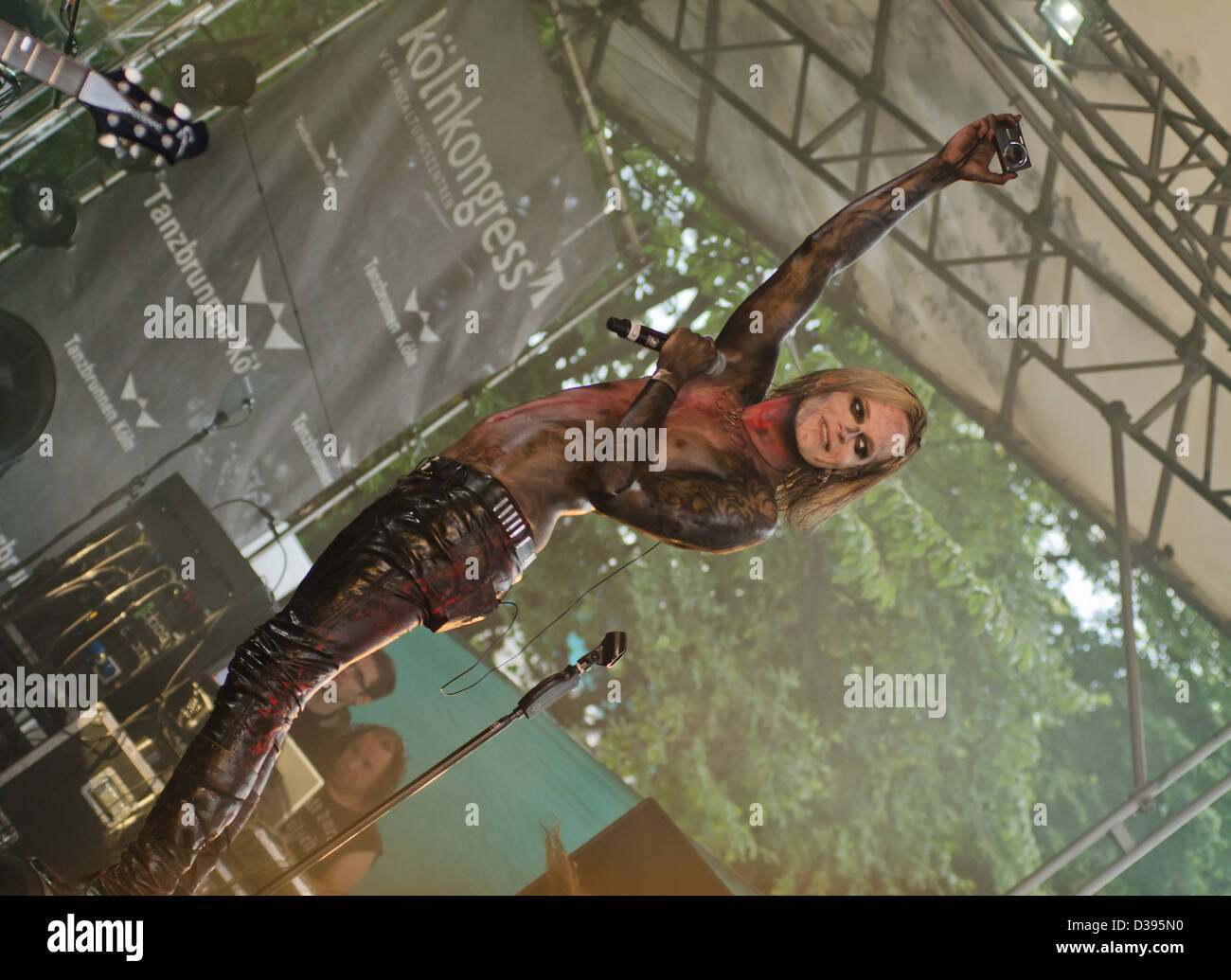 Chris Harm from the German gothic-rock band the Lord of the Lost, taking a photo of the audience at the Amphi Goth Festival Stock Photo