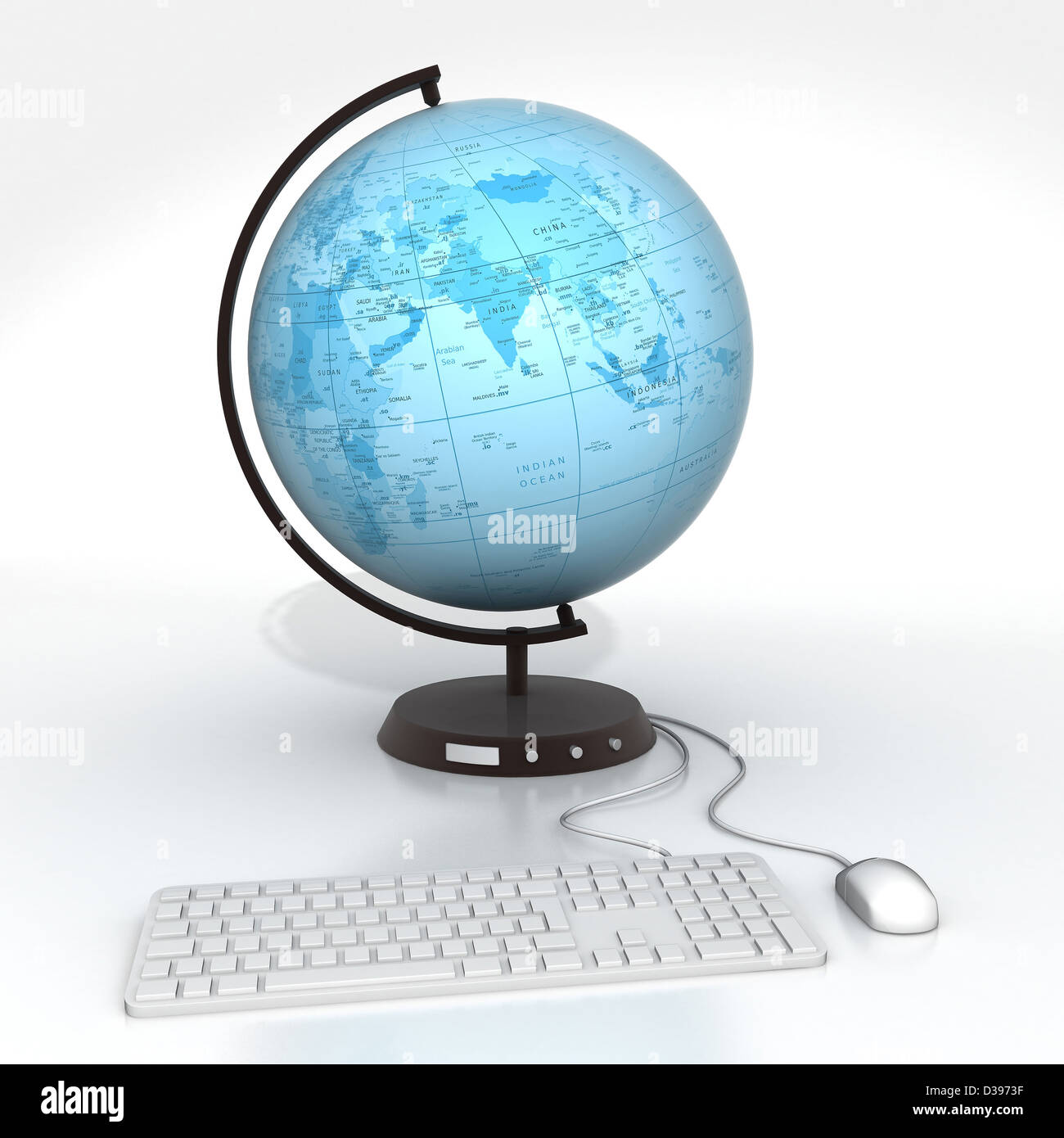 Conceptual image of desktop globe attached to computer keyboard and mouse depicting global communications Stock Photo