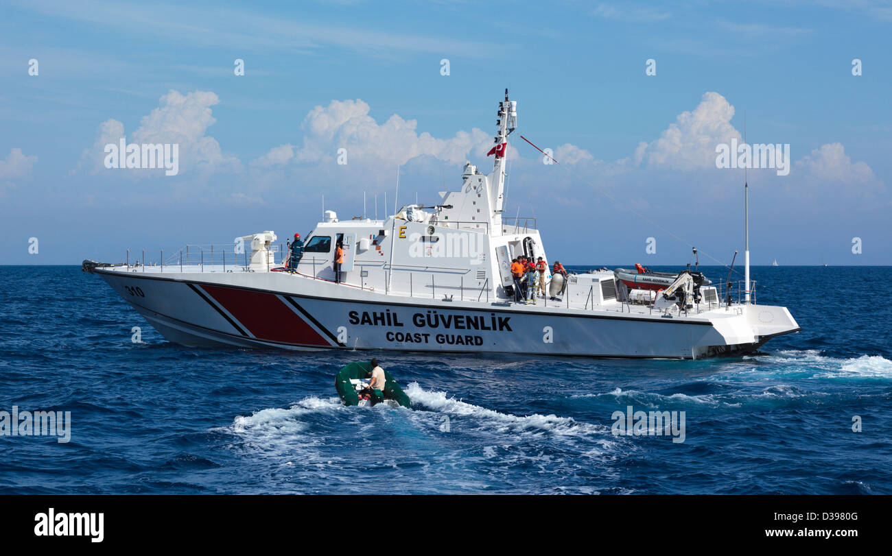 Turkish coast guard called to a fire on a tourist boat at sea near Marmaris, one of the boat's saviours is going to brief them Stock Photo