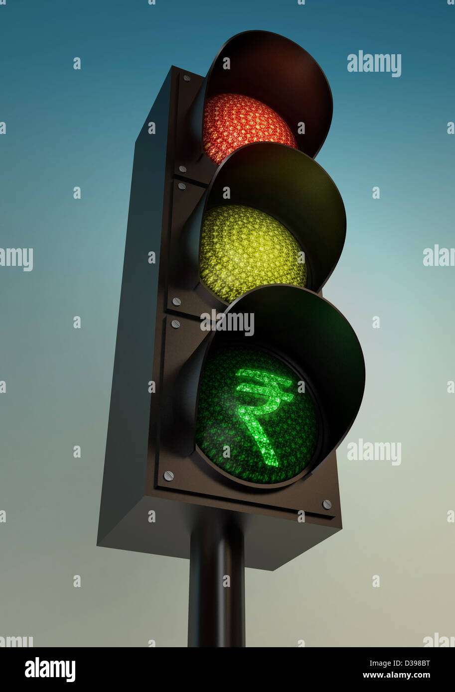 Low angle view of Indian Rupee on traffic light against clear sky Stock Photo