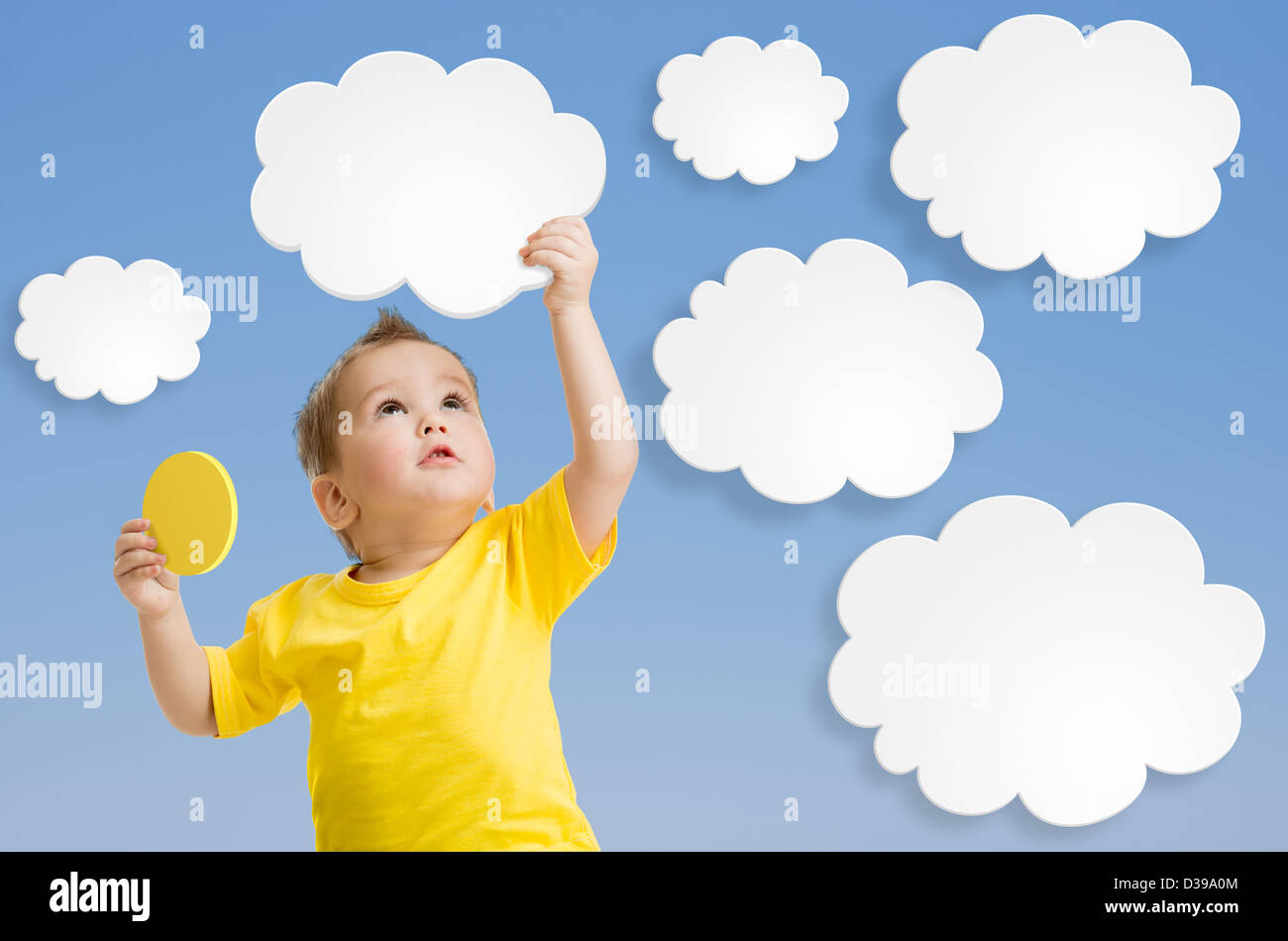 Kid or child keep cloud and sun in his hands Stock Photo