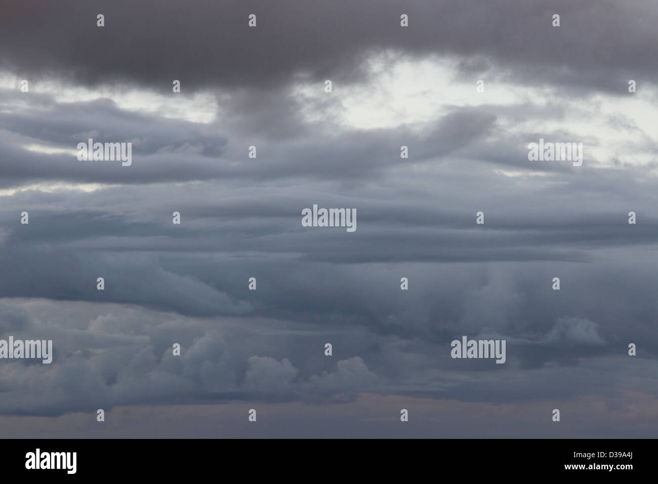 Dramatic clouds in a grey sky Stock Photo - Alamy