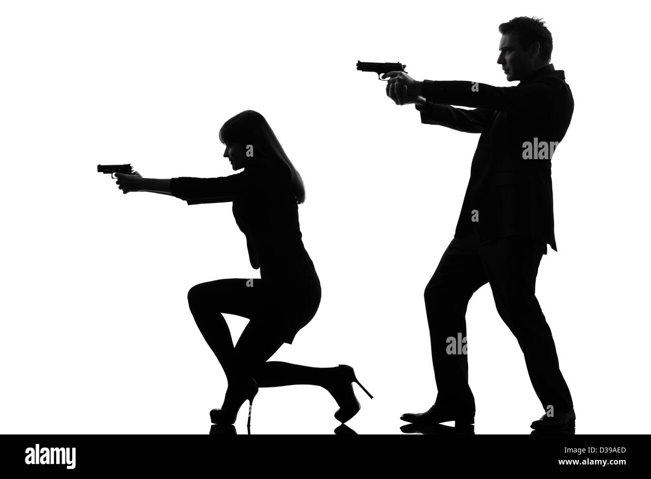 one  man detective secret agent criminal with gun in silhouette studio isolated on white background Stock Photo
