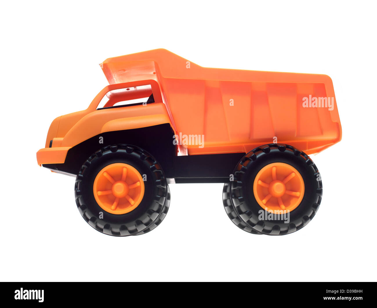 A toy dump truck isolated against a white background Stock Photo - Alamy