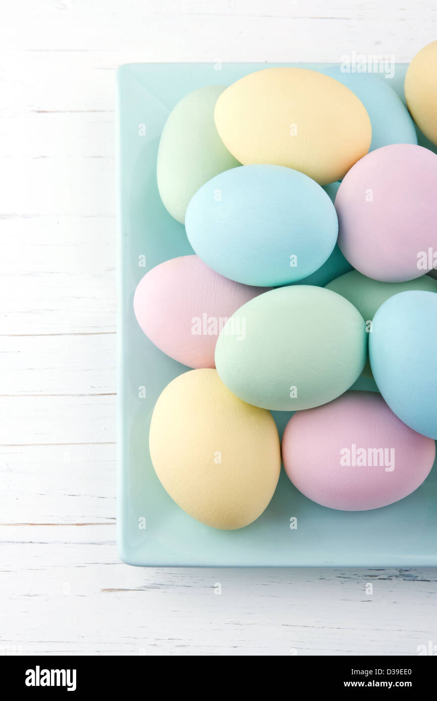 Colorful pastel easter eggs on white wooden background Stock Photo