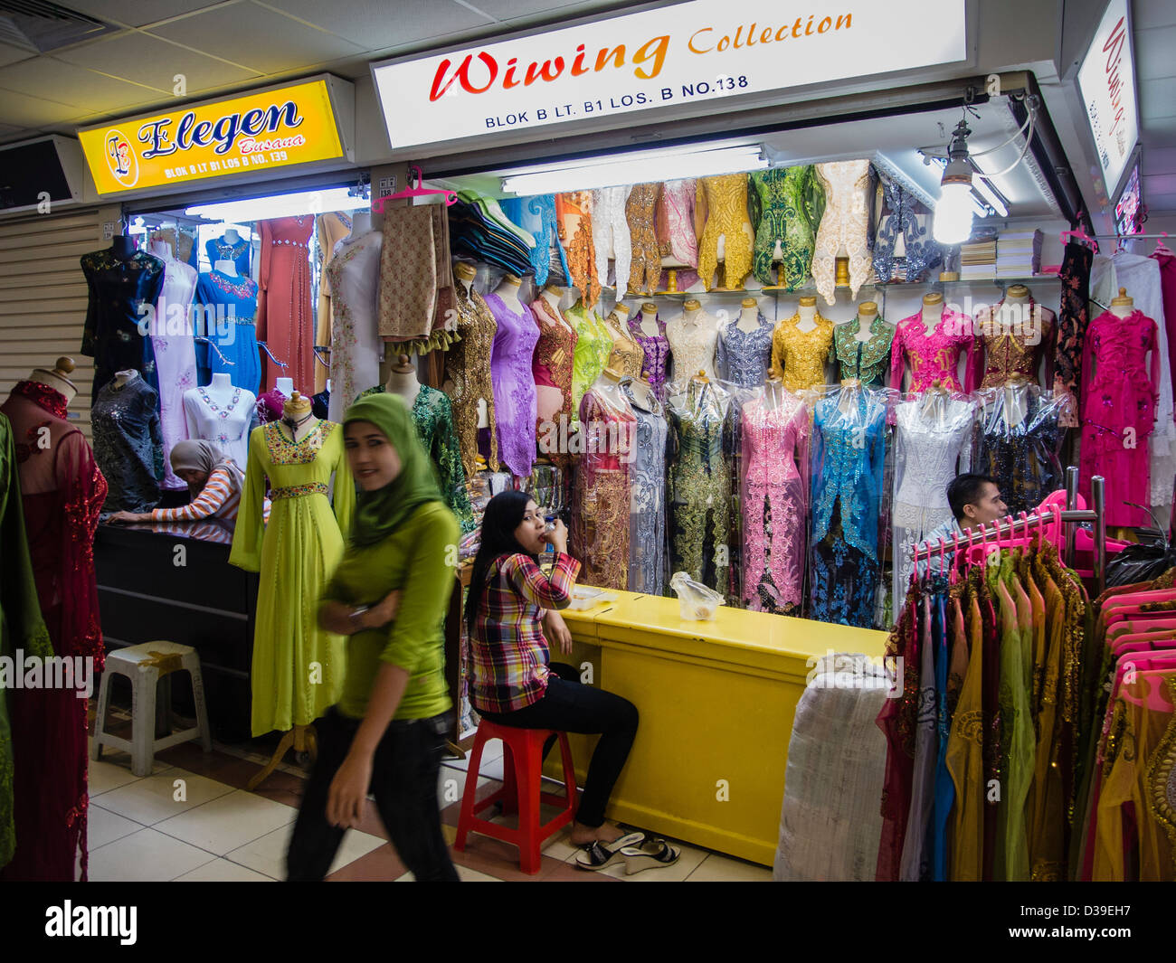 Growing demand for muslim female fashion in Indonesia. Here mostly in bright colors on the Tanah Abang market in Jakarta. Stock Photo