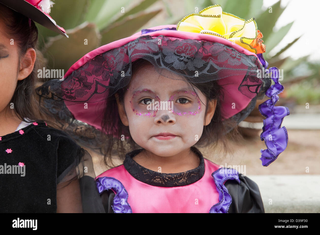 Young girl dressed in costume for Day of the Dead children's parade
