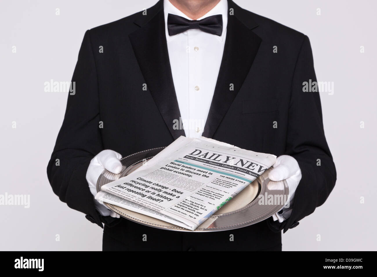 Butler delivering your Daily Newspaper. Mock up paper. Stock Photo