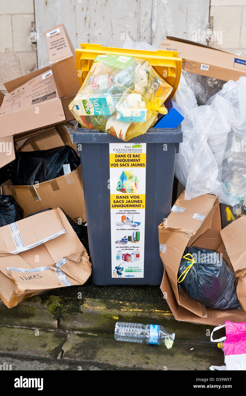 Overflowing rubbish bins awaiting collection France Stock Photo Alamy