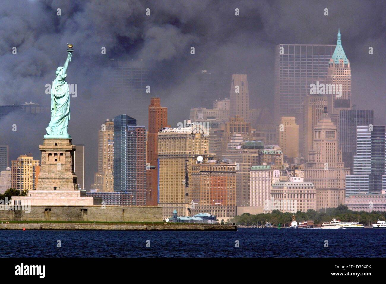 (dpa) The Statue of Liberty faces the smokeburied skyline of