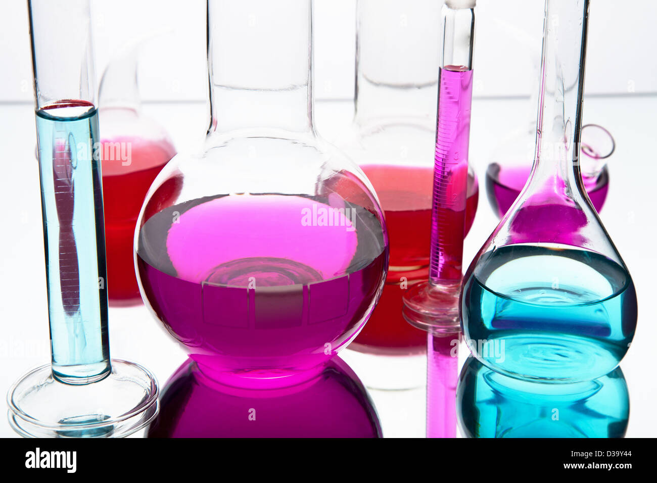 laboratory glassware with colorful chemicals Stock Photo