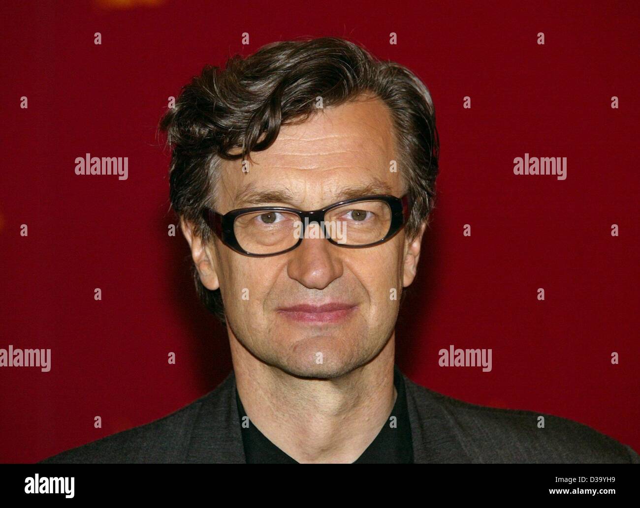 (dpa) - Berlinale: German film director Wim Wenders ('Paris, Texas')  presents his new film 'Ode to Cologne', a nostalgic documentary about the 20-year career of the popular German rockband BAP from Cologne, at the 52. International Film Festival in Berlin, 13.2.2002. The movie is shown at the Berli Stock Photo