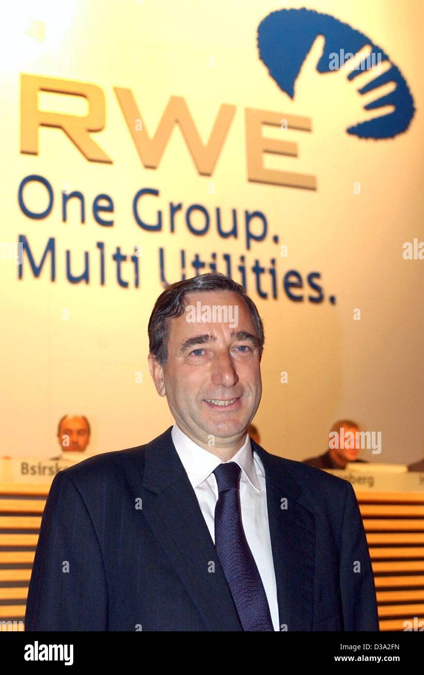 (dpa) - Harry Roels, future chairman of energy supplier RWE, pictured underneath the group's logo before the general meeting in Essen, 6 June 2002. The 53-year-old dutch Shell manager will succeed chairman Dietmar Kuhnt in February 2003. Stock Photo