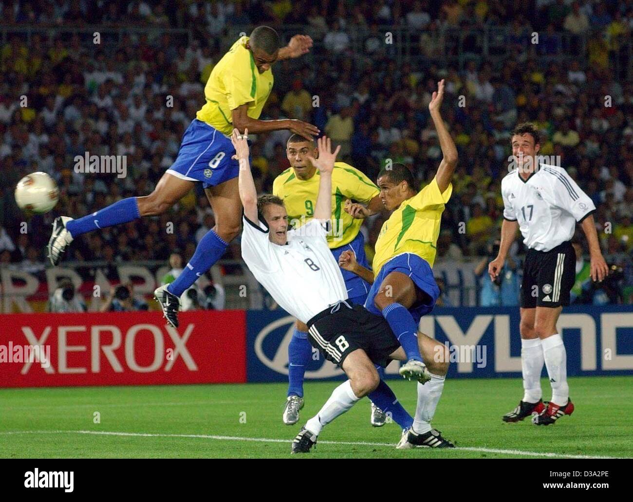 (dpa) - Gilberto Silva (left up), Brazil's  midfielder and Rivaldo (second right) fight for the ball against German's midfielder Dieter Haman (C) as Brazil's forward Ronaldo and Germany's Marco Bode (right behind) look on during the Germany/Brazil final of the 2002 FIFA World Cup in Japan, 30 June 2 Stock Photo