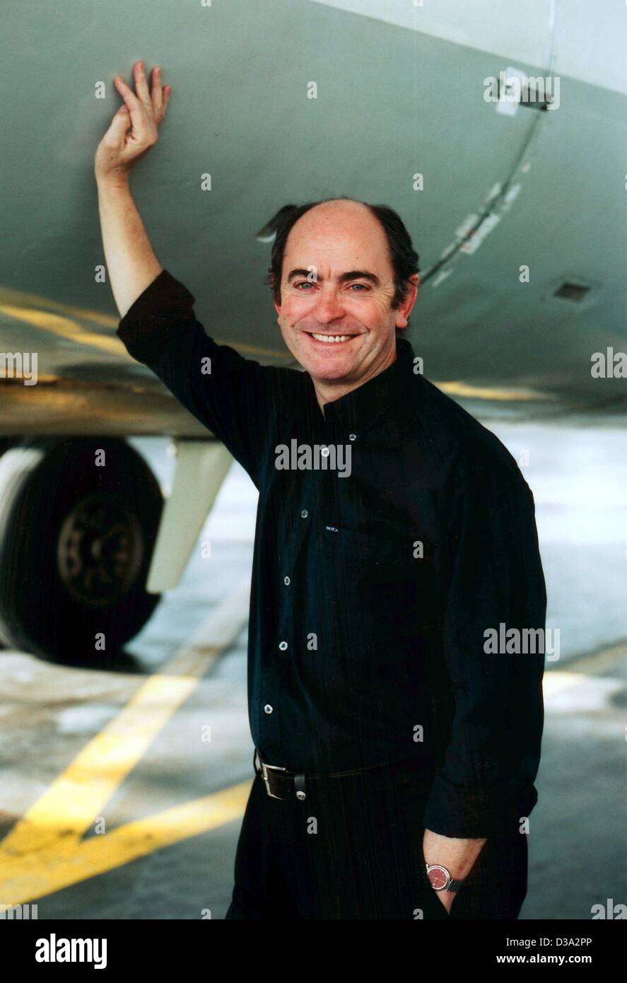 (dpa) - Adrian Hunt, CEO of the airline Deutsche BA (dba), poses underneath an aircraft (undated). British Airways, holding company of dba, has offered its rival Easyjet, a low-cost airline, a deal to buy its German arm for a price between 30 and 46 million euro until March 2003. Easyjet is also in  Stock Photo