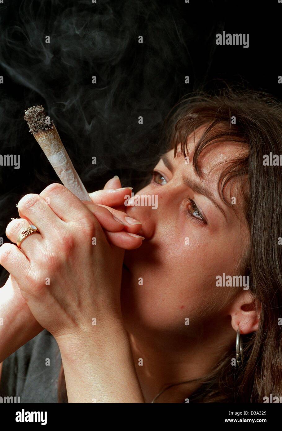 (dpa files) - An undated file picture shows Sabine smoking a joint in Frankfurt. Stock Photo