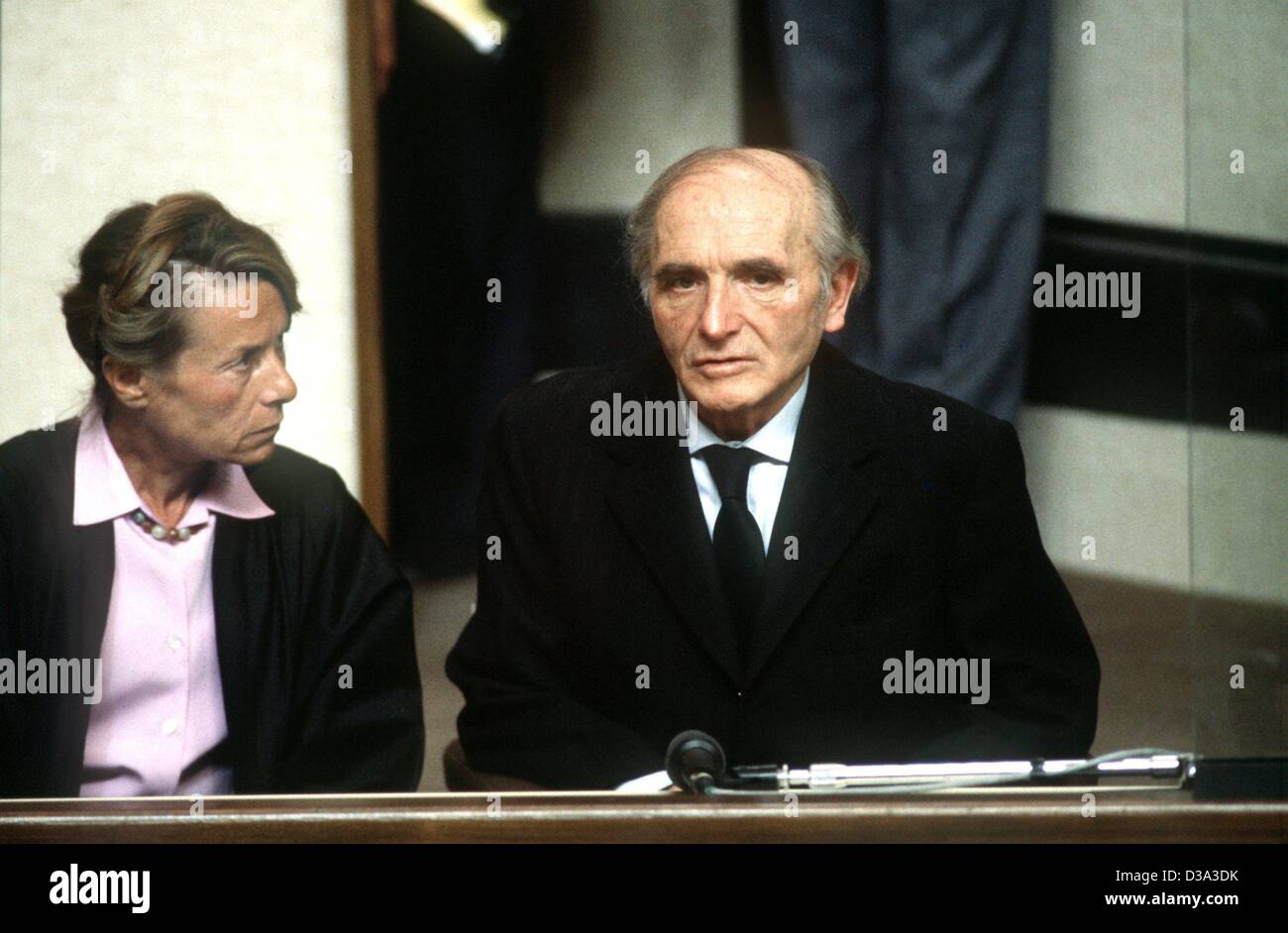 (dpa files) - Klaus Barbie, former German Secret State police (Gestapo) of the city of Lyon, sits with a translator during his trial in a court room in Lyon, France, 11 May 1987. Barbie was accused of crimes against humanity. Stock Photo