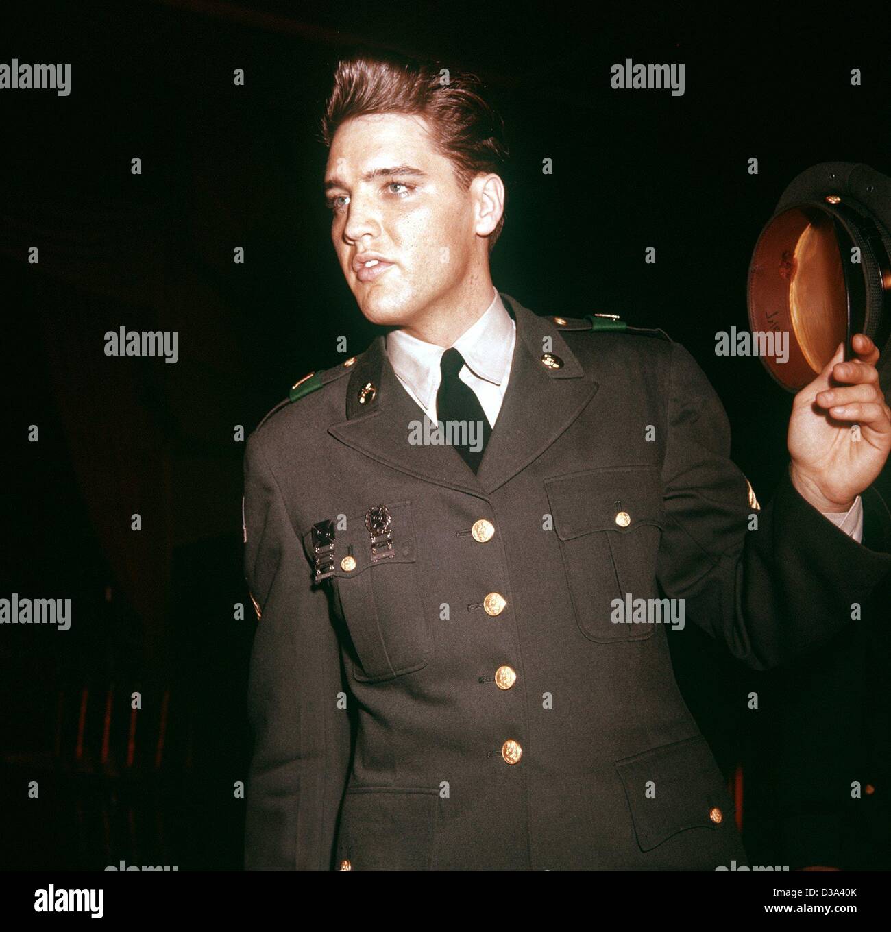 (dpa) - Elvis Presley, shortly before leaving Germany, 1 March 1960. The American rock 'n' roll star did part of his military service at Ray Barracks in Upper Hesse at the end of the 50s. Stock Photo