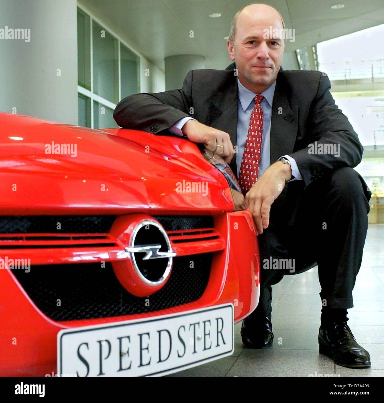 (dpa files) - Carl-Peter Forster, chairman of the Adam Opel AG, poses at a new Opel Speedster in Ruesselsheim near Frankfurt (Germany), 3 July 2001. Stock Photo