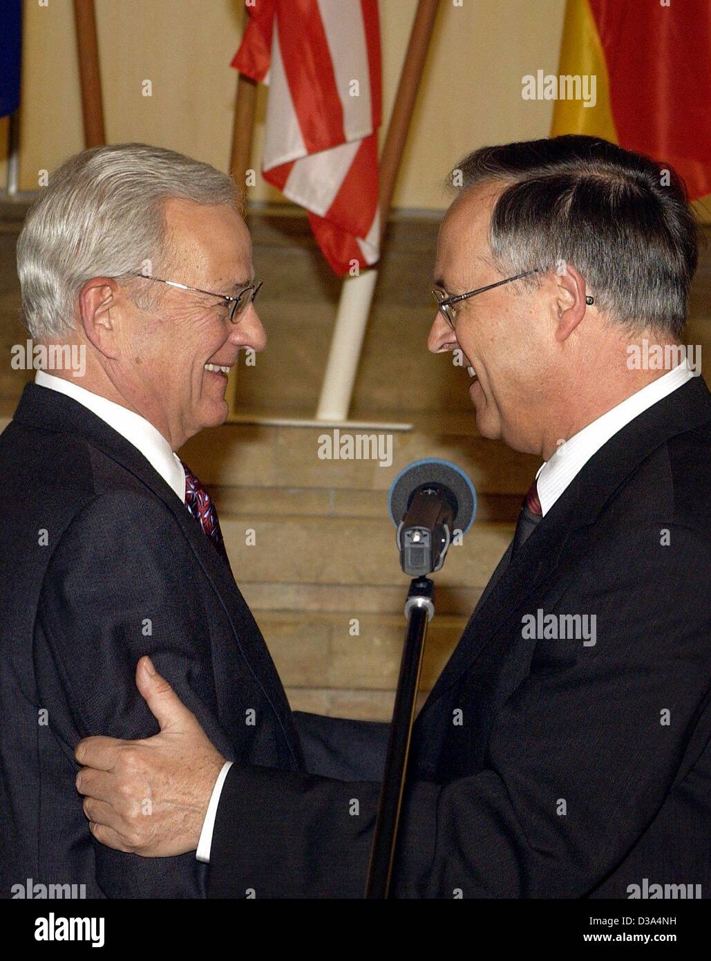 (dpa) - German Finance Minister Hans Eichel (R) greets his US-American counterpart Paul O'Neill in Berlin, 9 April 2002. After their talk Eichel said that international measures against terrorist capital have developed to the satisfaction of both countries. Stock Photo