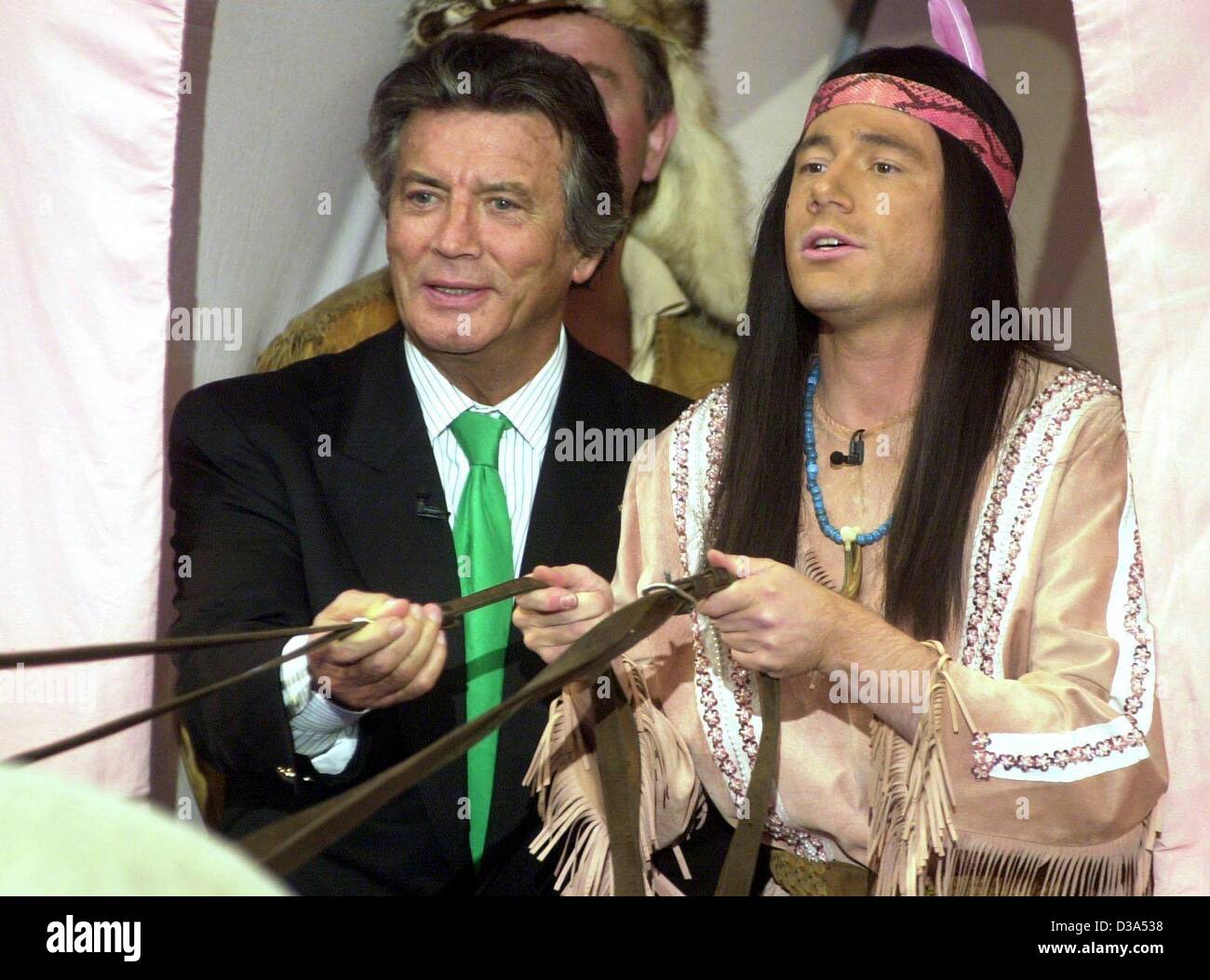 (dpa files) - Michael 'Bully' Herbig (R), German actor and director of the German hit western comedy 'Der Schuh des Manitu' ('Manitou's Shoe'), promotes his movie with French actor Pierre Brice in a covered wagon on a German television show in Erfurt, Germany, 13 October 2001. In the film, Herbig pl Stock Photo