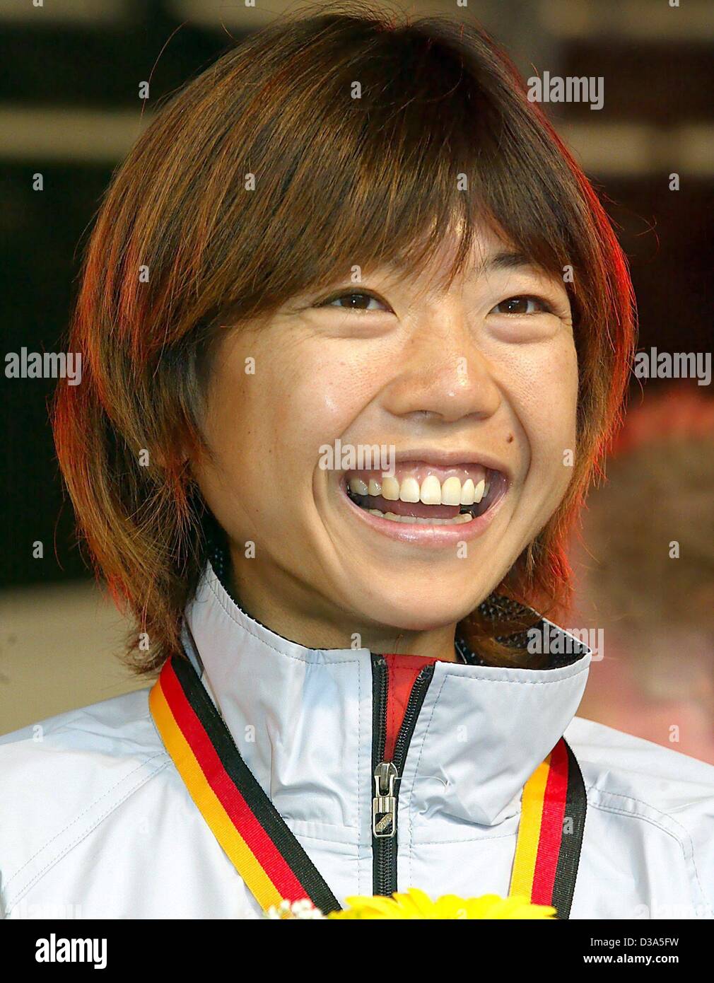 (dpa) - Japan's Naoko Takahashi on the podium after winning the marathon in Berlin, 29 September 2002. The 30-year-old wins with a time of 2hrs 21min 23sec. Stock Photo