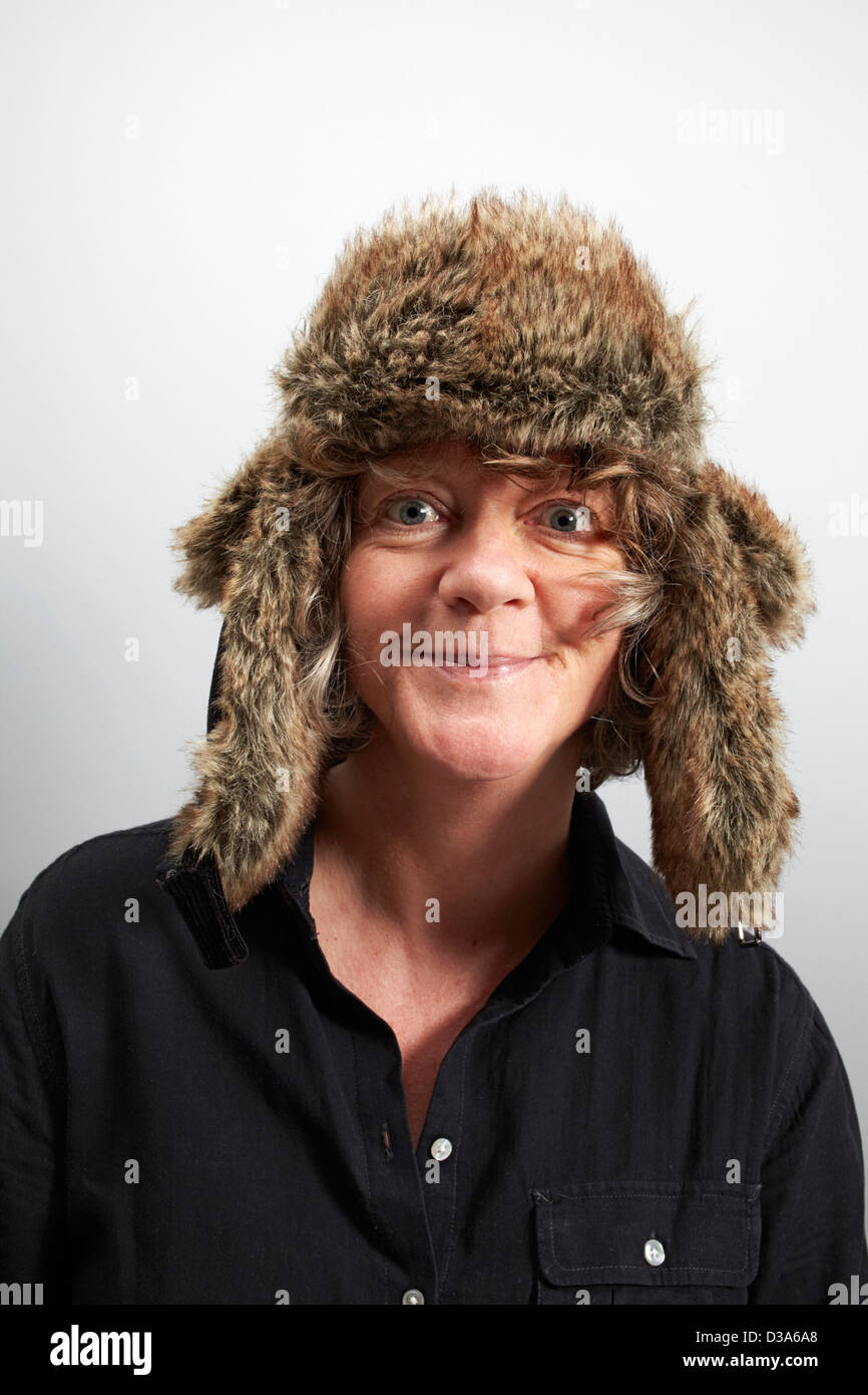 Forty plus woman wearing silly hat and looking mad Stock Photo