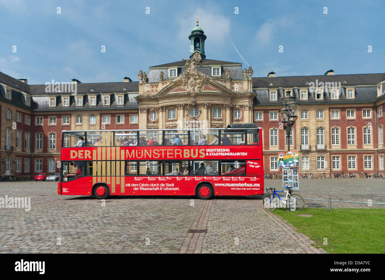 red tourist bus in front of the munster palace. Stock Photo