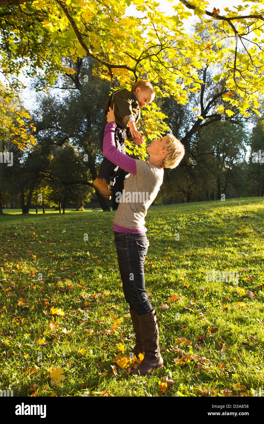 Mother and son playing in park Stock Photo