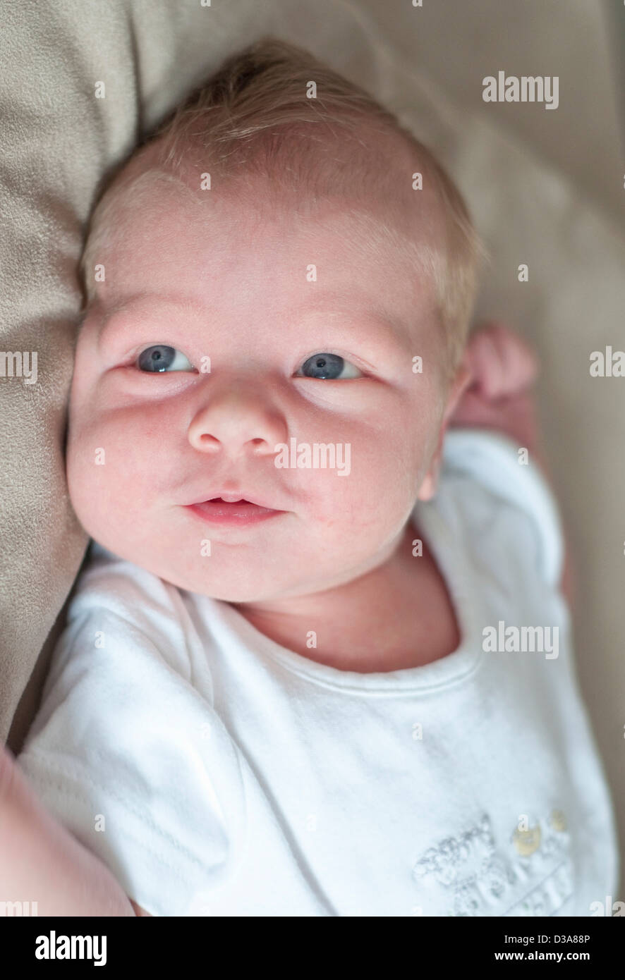 Infant boy laying on pillow Stock Photo