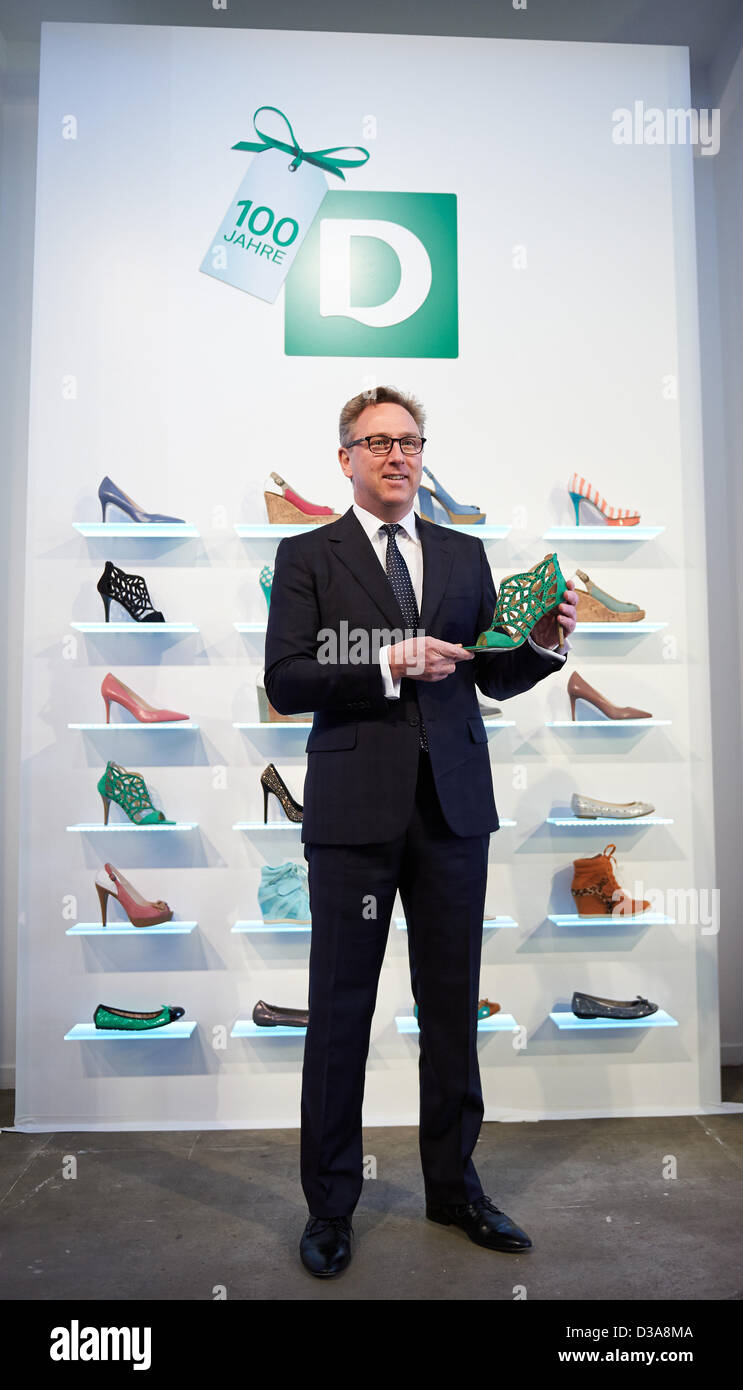 Chairman of the Administrative Board at Deichmann SE, CEO Heinrich Deichmann,  presents a shoe during a press conference on the 100th anniversary of the  shoe fashion chain in Esssen, Germany, 14 February