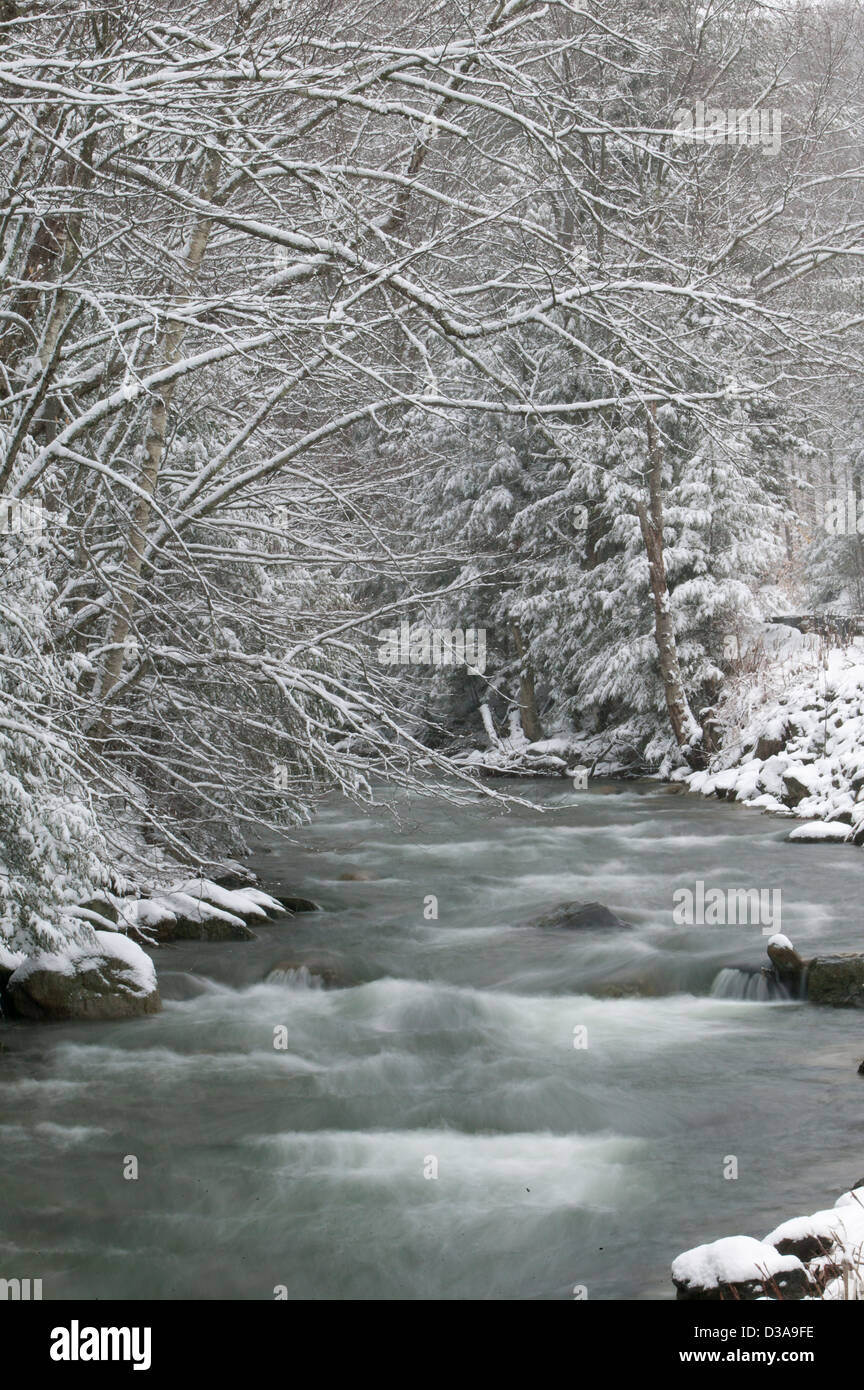 Stream flowing through snow covered hi-res stock photography and images ...