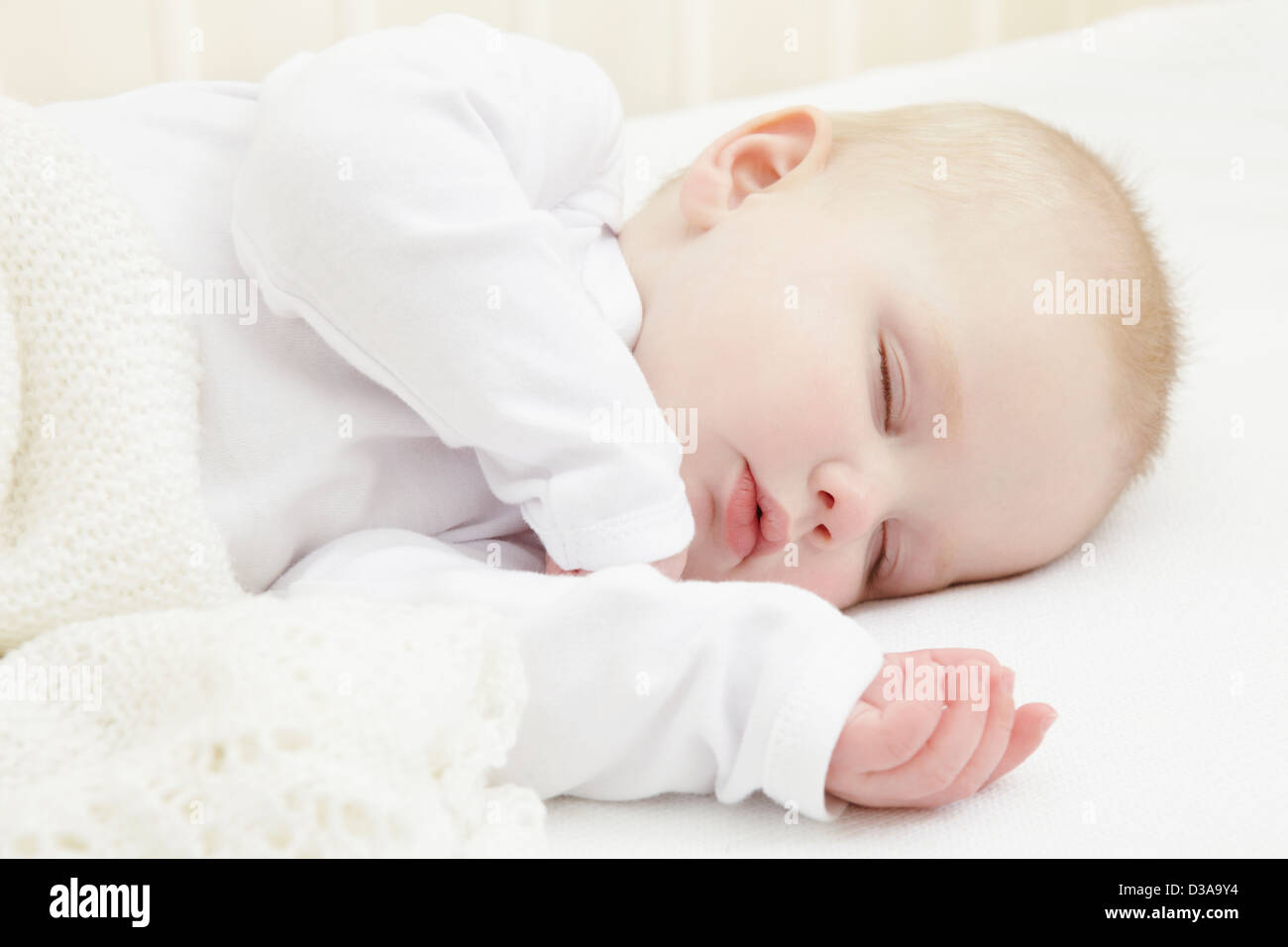 Baby girl sleeping in crib Stock Photo Alamy
