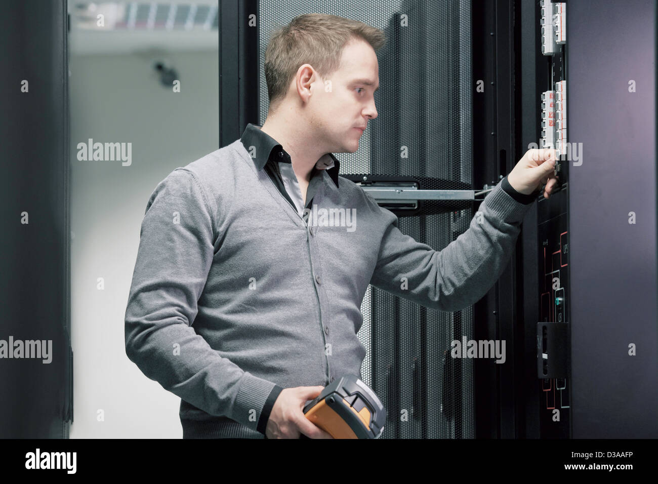 Man working in server room Stock Photo