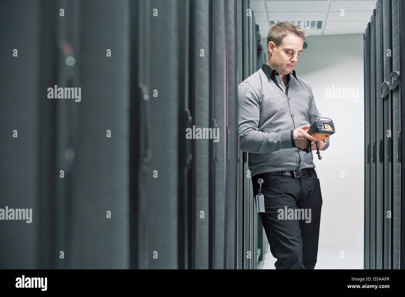 Man working in server room Stock Photo
