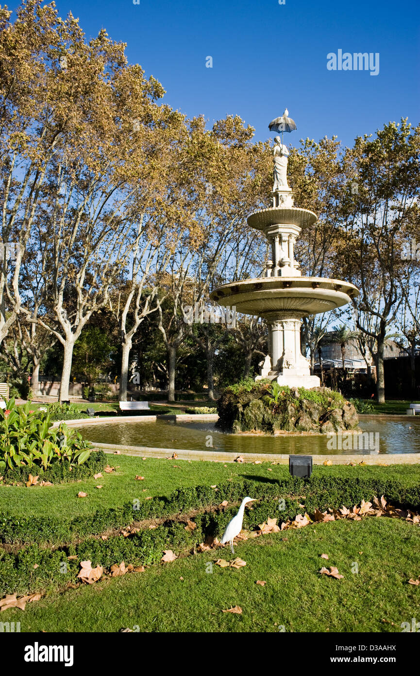 Modernist statue of a woman with an umbrella in the Barcelona Zoo Stock