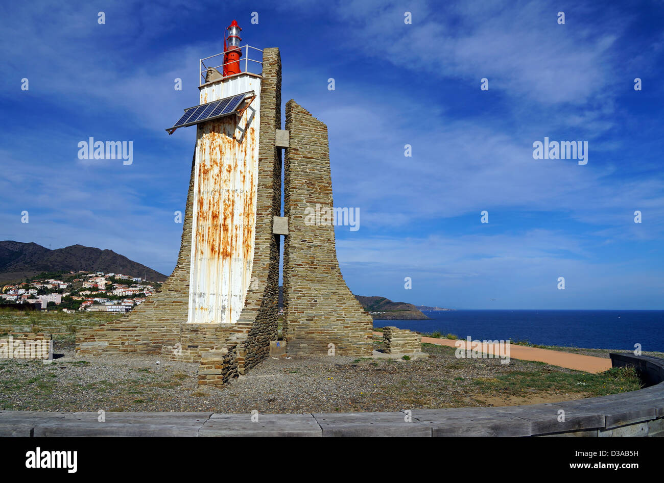 A lighthouse powered by solar panels on the Cap Cerbere at the border between Spain and France, Mediterranean sea Stock Photo