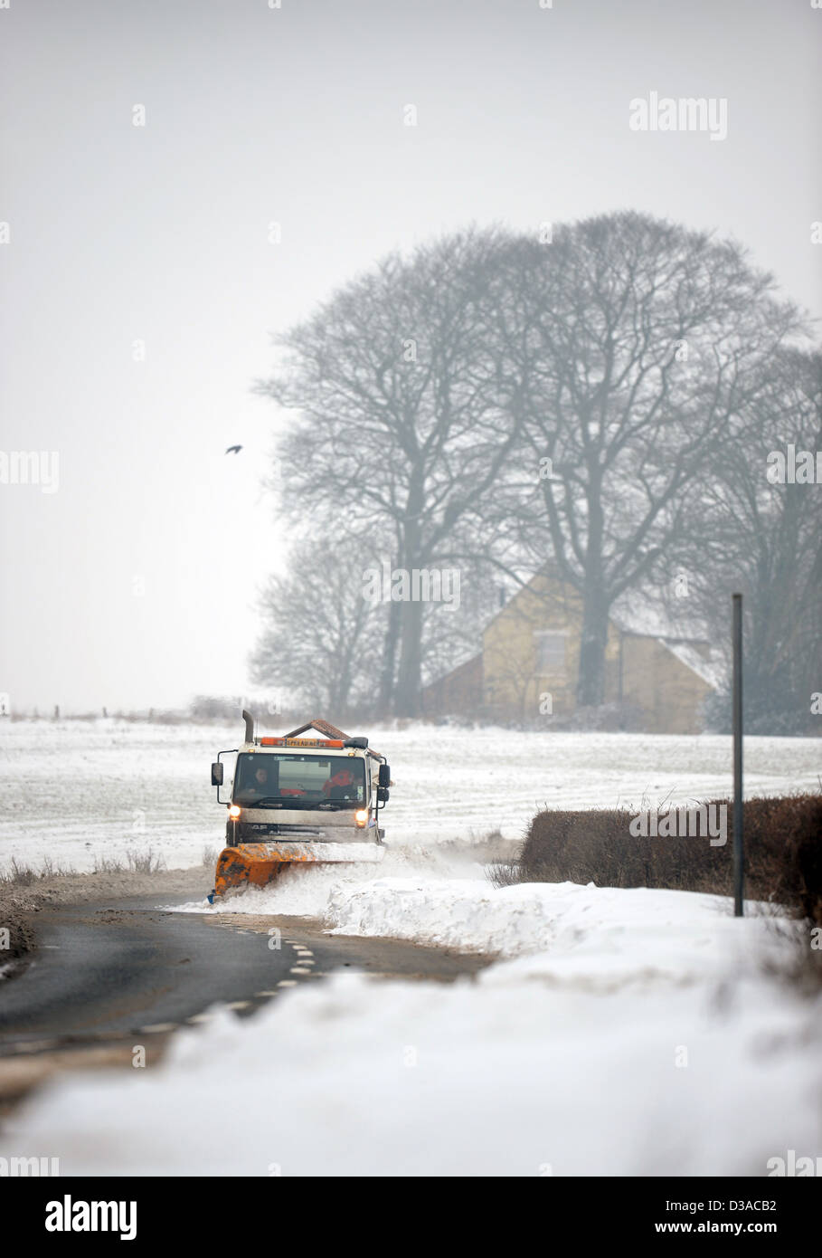 A snow plough on the A46 near Leighterton, Gloucestershire UK Jan 2013 Stock Photo