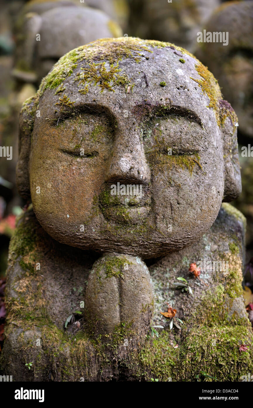 Groups of small religious statues in a temple garden Stock Photo Alamy