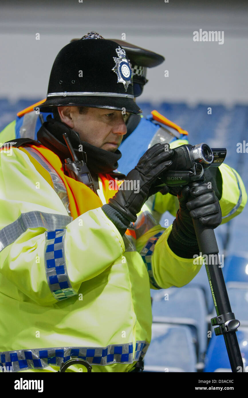 video surveillance by trained police officers at a UK football match Stock Photo