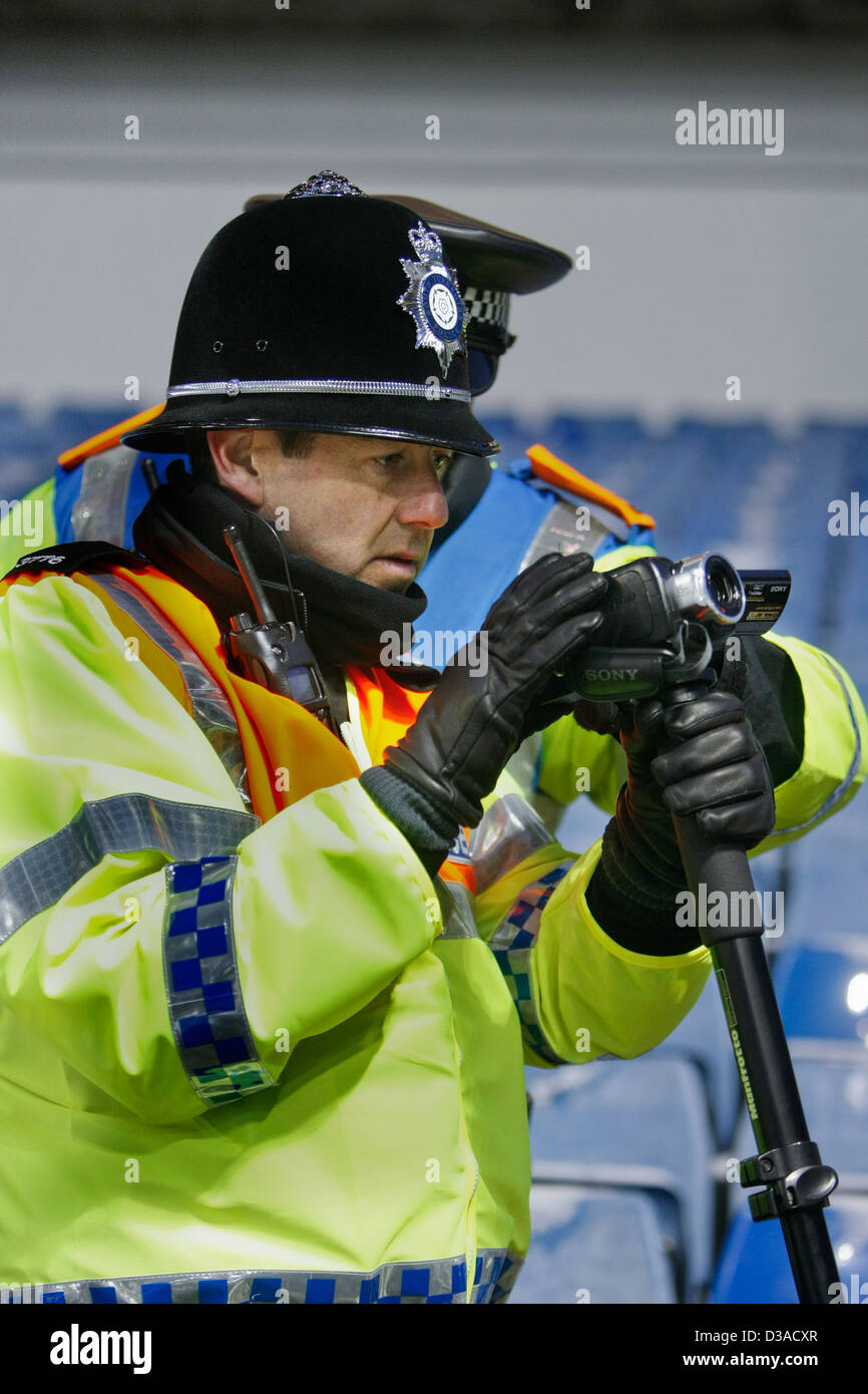 video surveillance by trained police officers at a UK football match Stock Photo