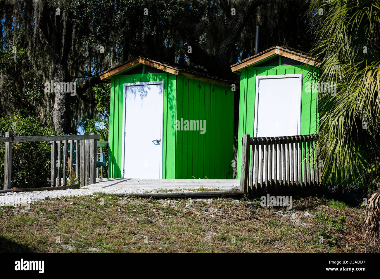 His and Hers outside toilets Stock Photo